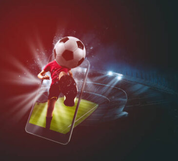 Soccer players, cellphone and ball on a stadium