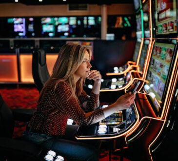 Women gambling on slot machinery