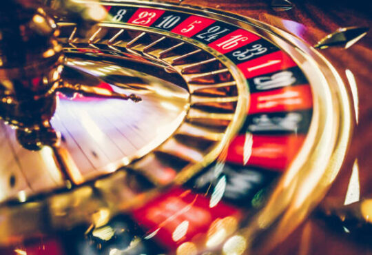 Spinning professional roulette wheel in casino. Property released.