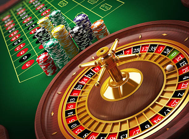 Roulette wheel and casino chips on the table.Similar images: