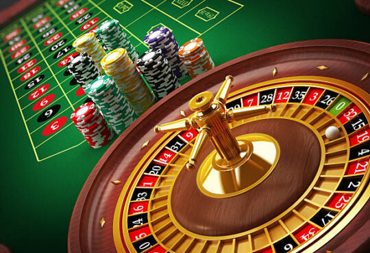 Roulette wheel and casino chips on the table.Similar images: