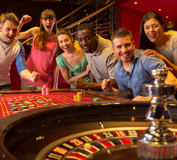 Group Of Friends Playing Roulette In Casino